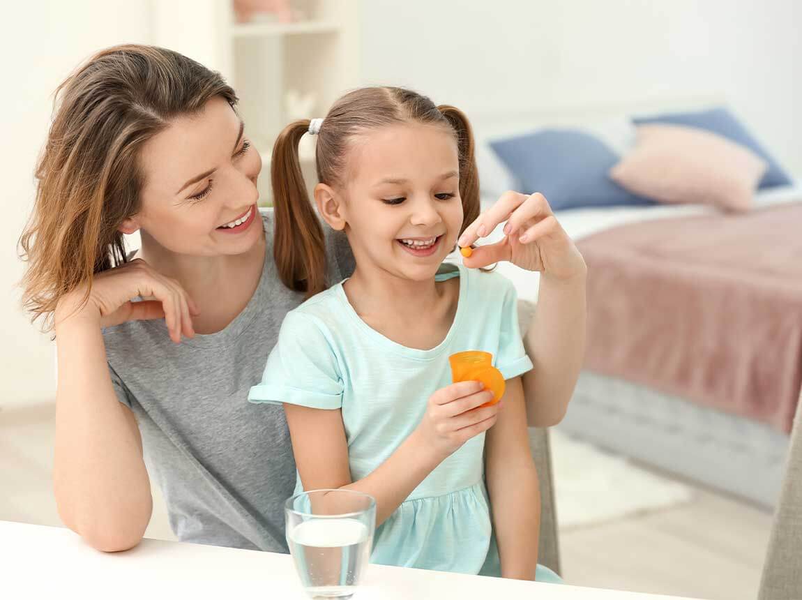 a woman with a child &ndash; zinc tablets