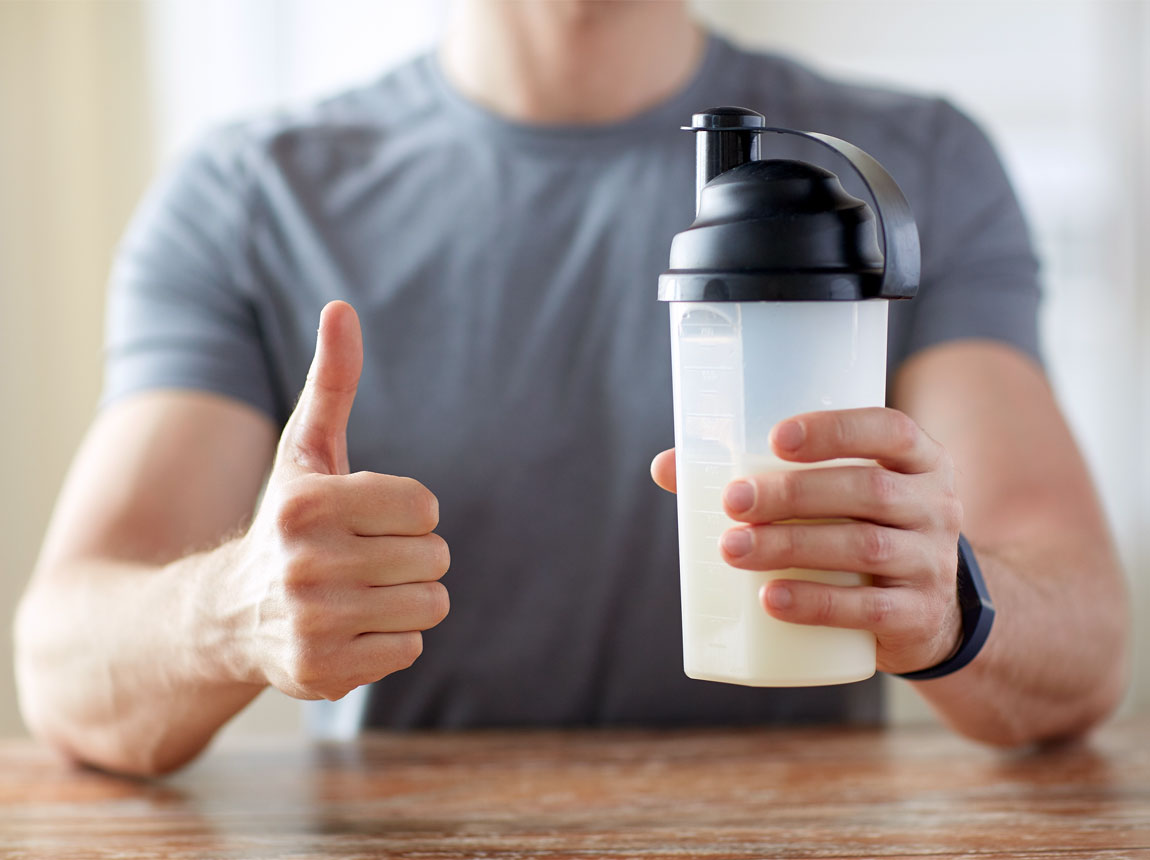 a man with a protein shake