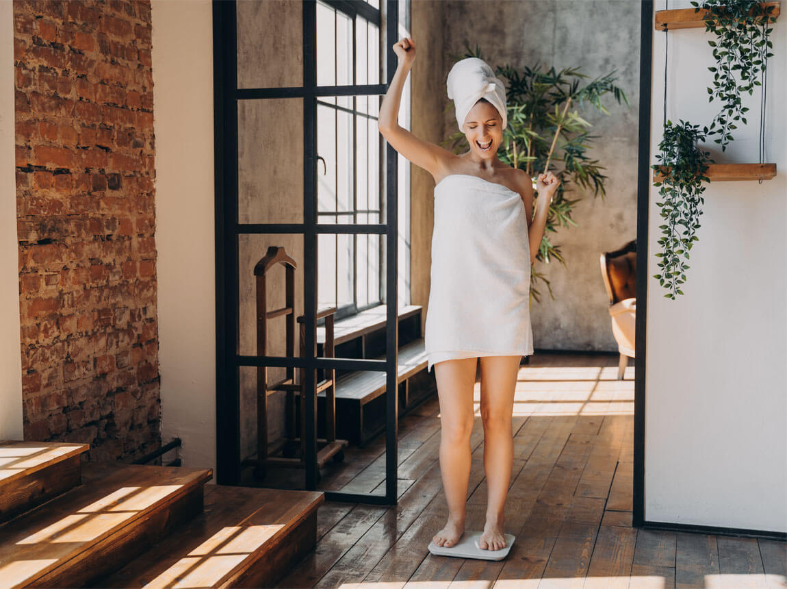 woman on scales - weight loss
