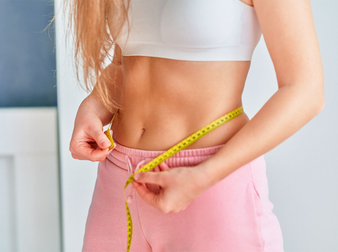 woman with a tape measure - weight loss
