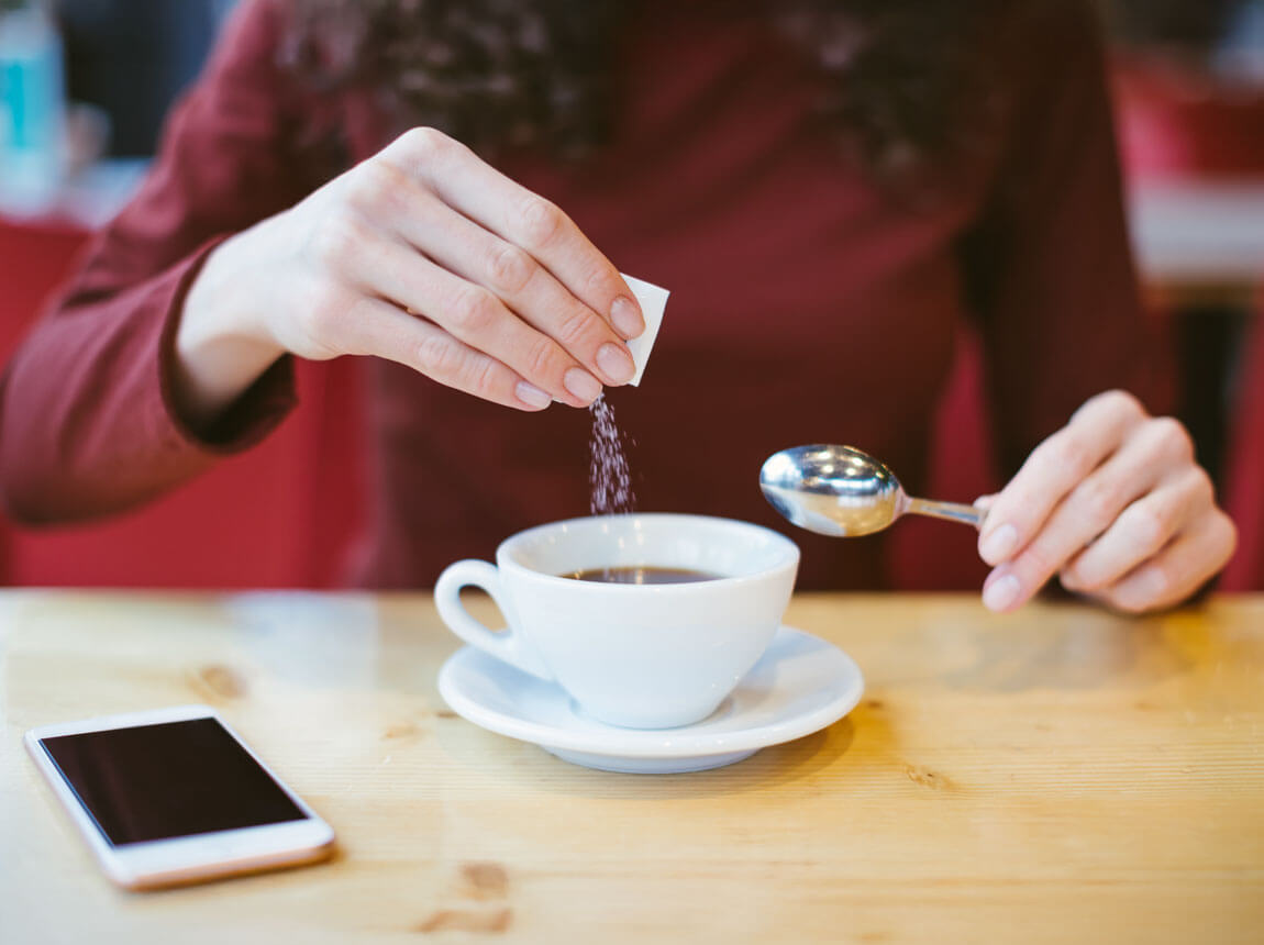 sucralose - woman with coffee  