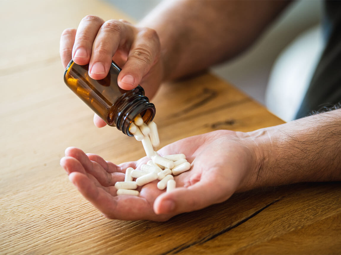 man with capsule - dietary supplement