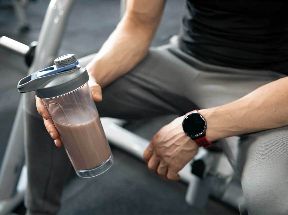 a man with a protein shake