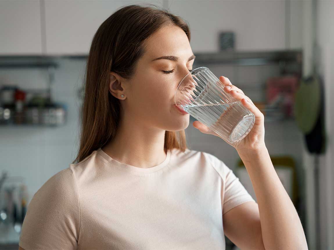 a woman with a glass of water